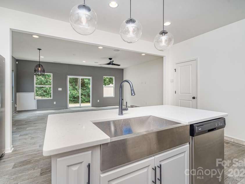 12016 Basking Drive, Charlotte, NC 28214.  MLS# CAR4266827, YatesRealty ID 29436. Kitchen #4 View from sink into family room