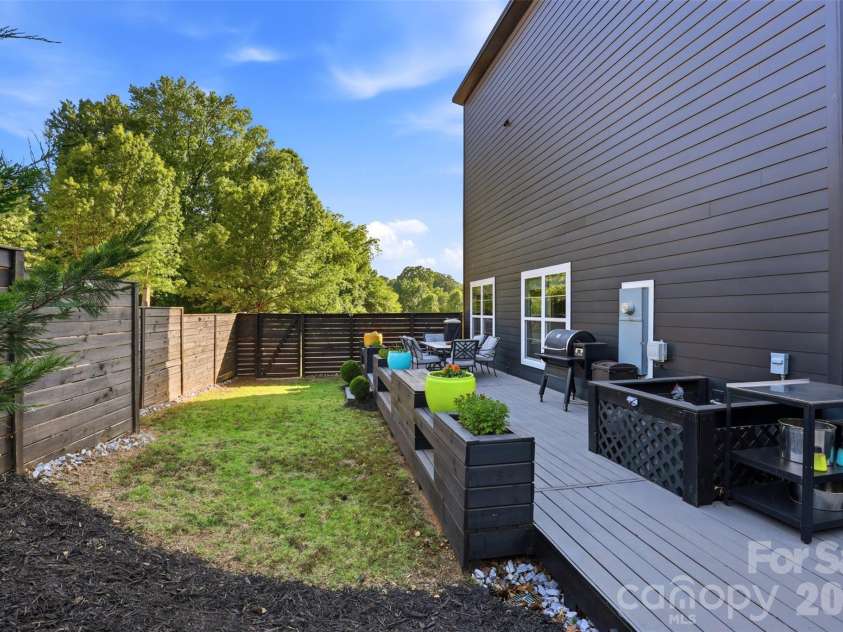 715 28th Street, Charlotte, NC 28205.  MLS# CAR4383784, YatesRealty ID 29441. Side yard with deck