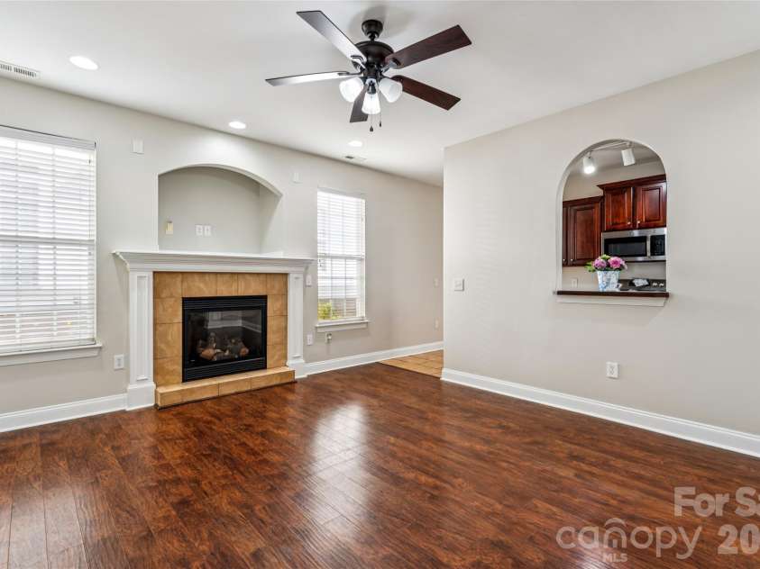 12807 Windy Lea Lane, Huntersville, NC 28078.  MLS# CAR4372915, YatesRealty ID 2945. Livingroom with beautiful floors and gas fireplace