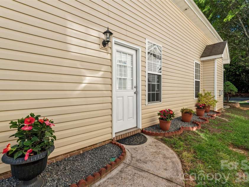 12807 Windy Lea Lane, Huntersville, NC 28078.  MLS# CAR4372915, YatesRealty ID 2945. Side door connecting to patio and garage