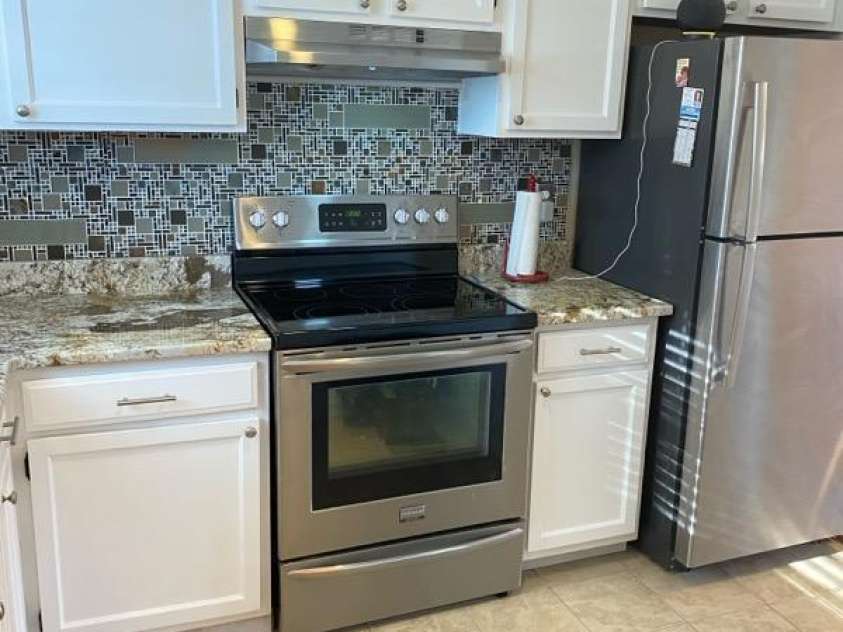 6130 Heathstone Lane, Charlotte, NC 28210.  MLS# CAR4326892, YatesRealty ID 2945. SS APPLIANCES - REFRIGERATOR REMAINS