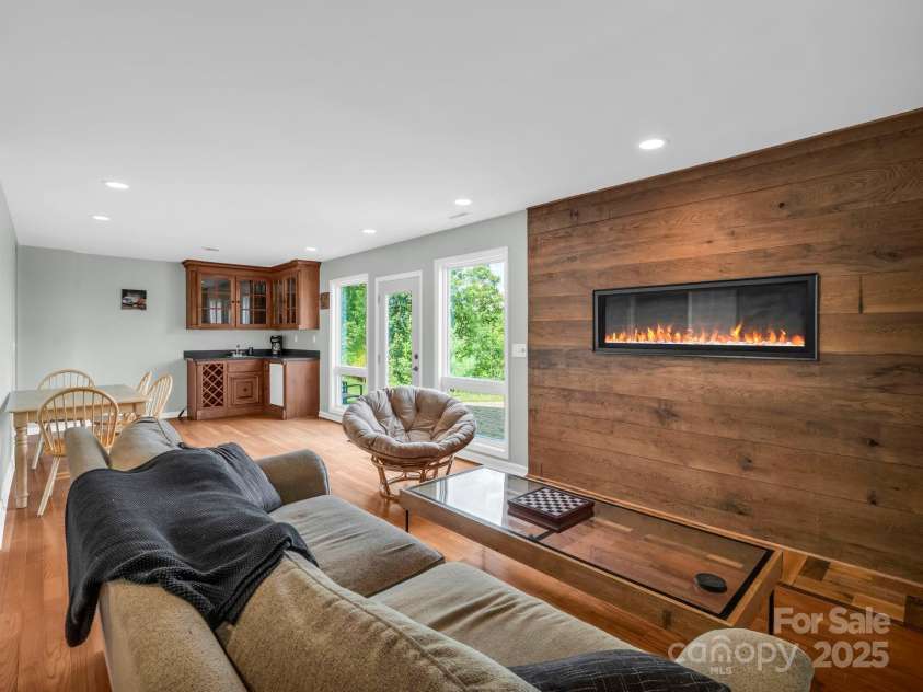 995 Towery Trace, Ellenboro, NC 28040.  MLS# CAR4287320, YatesRealty ID 29459. Basement living room area