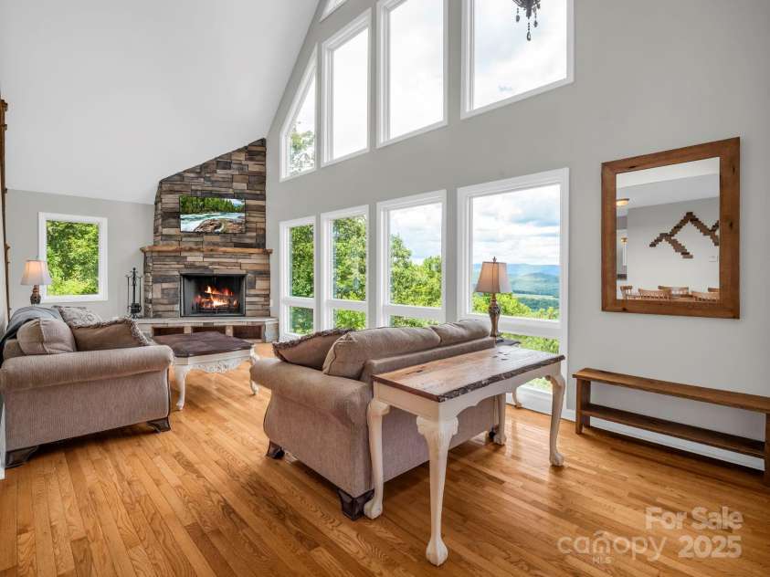 995 Towery Trace, Ellenboro, NC 28040.  MLS# CAR4287320, YatesRealty ID 29459. Living room with wood burning fireplace.