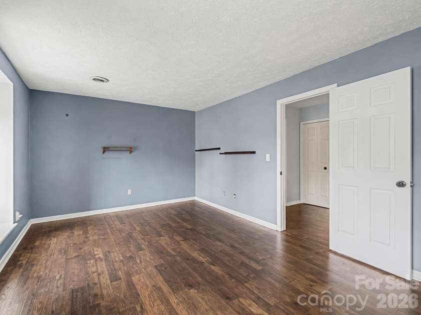 1409 Kensington Road, Hendersonville, NC 28791.  MLS# CAR4345772, YatesRealty ID 2946. Guest Bedroom, view 2, looking back toward the upper level hallway