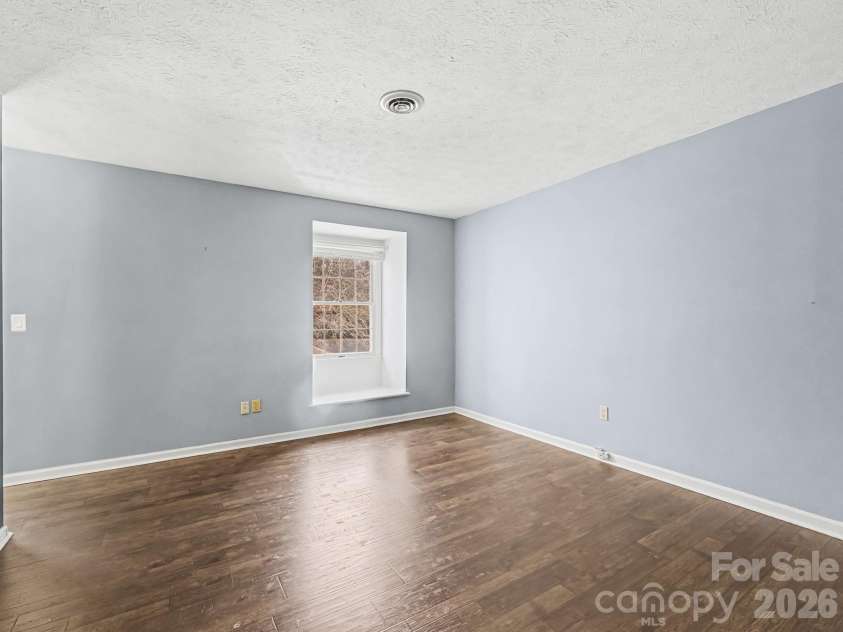 1409 Kensington Road, Hendersonville, NC 28791.  MLS# CAR4345772, YatesRealty ID 2946. Large Primary Bedroom, view 1, stepping in from upstairs hallway