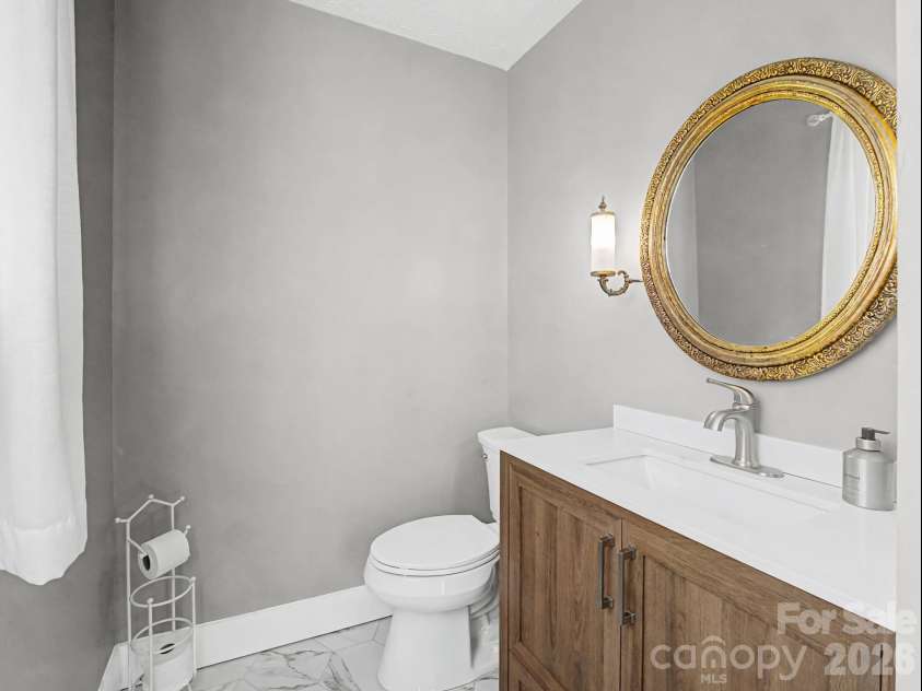 1409 Kensington Road, Hendersonville, NC 28791.  MLS# CAR4345772, YatesRealty ID 2946. Powder room, off of hallway at front entrance