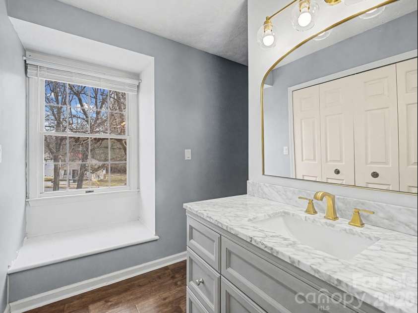 1409 Kensington Road, Hendersonville, NC 28791.  MLS# CAR4345772, YatesRealty ID 2946. Primary en suite bathroom vanity area