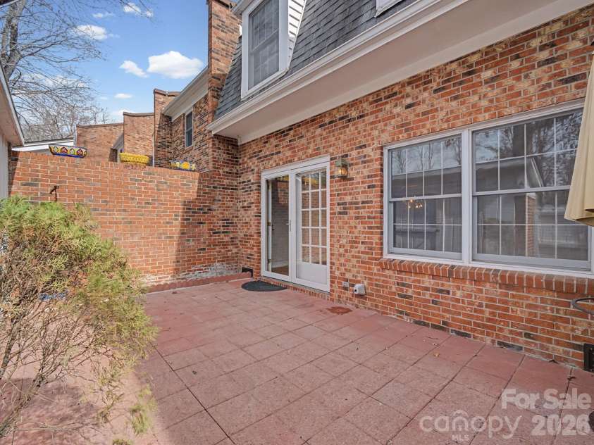 1409 Kensington Road, Hendersonville, NC 28791.  MLS# CAR4345772, YatesRealty ID 2946. Private patio off of living room