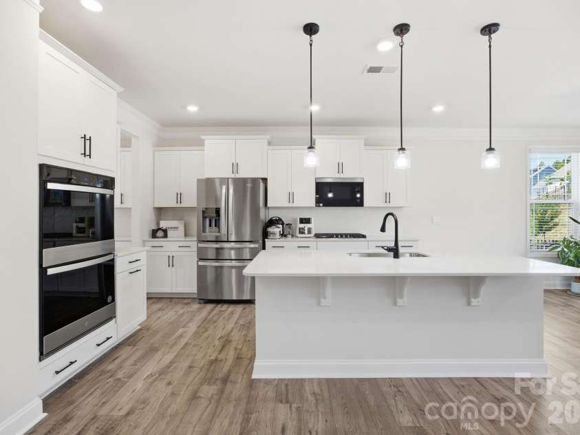 125 Saidin Lane, Troutman, NC 28166.  MLS# CAR4390174, YatesRealty ID 29465. Gourmet Kitchen with double ovens and quartz counters