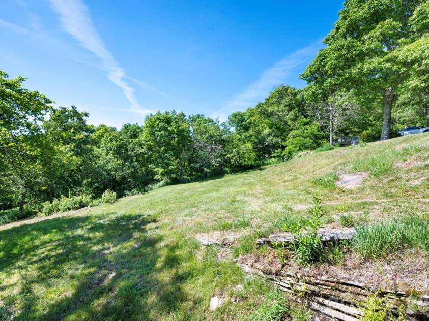 58 Randall Drive, Fairview, NC 28730.  MLS# CAR4388685, YatesRealty ID 29473. Ample Yard Space