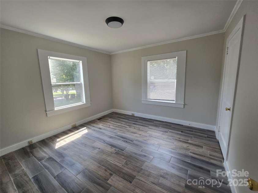 105 Eastside Drive, Concord, NC 28027.  MLS# CAR4287741, YatesRealty ID 29474. Front Bedroom