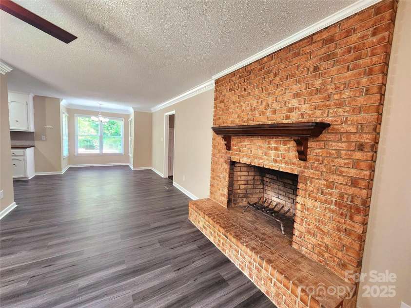 125 Circle Drive, Mount Holly, NC 28120.  MLS# CAR4276850, YatesRealty ID 29490. Beautiful brick fireplace