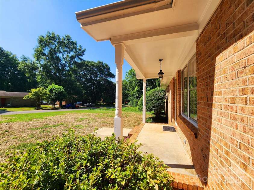 125 Circle Drive, Mount Holly, NC 28120.  MLS# CAR4276850, YatesRealty ID 29490. Covered front porch