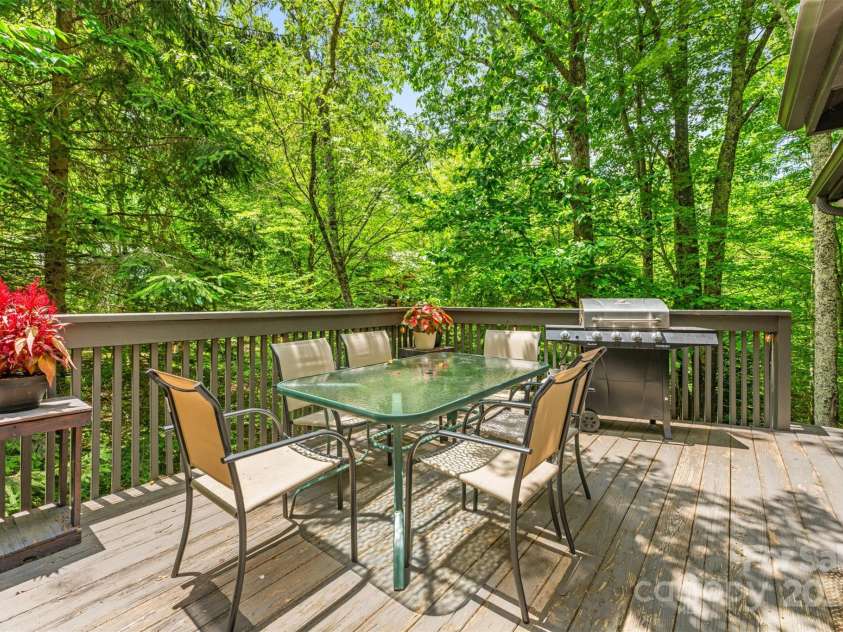321 Charter Hills Road, Beech Mountain, NC 28604.  MLS# CAR4276469, YatesRealty ID 29495. Dining porch overlooking creek