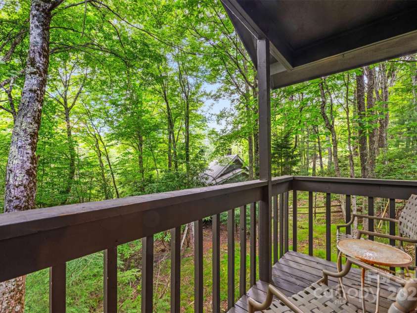 321 Charter Hills Road, Beech Mountain, NC 28604.  MLS# CAR4276469, YatesRealty ID 29495. Porch off primary overlooking creek