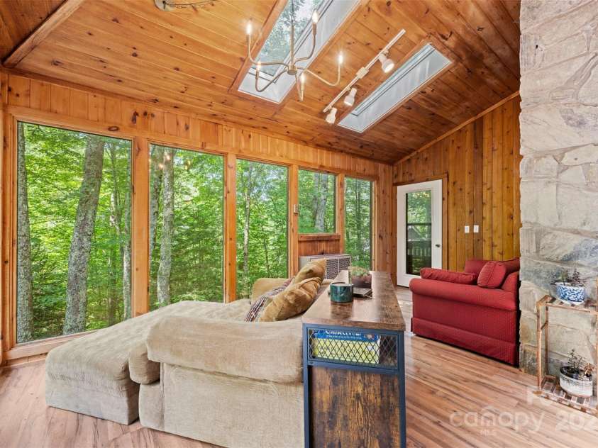 321 Charter Hills Road, Beech Mountain, NC 28604.  MLS# CAR4276469, YatesRealty ID 29495. Sunroom overlooking creek