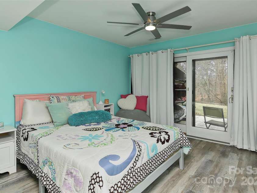 51 Old Post Road, Lake Wylie, SC 29710.  MLS# CAR4207674, YatesRealty ID 2950. 3rd bedroom w/new vinyl plank flooring, ceiling fan w/light and door that leads to covered back patio that over looks Lake Wylie and short walk to water!