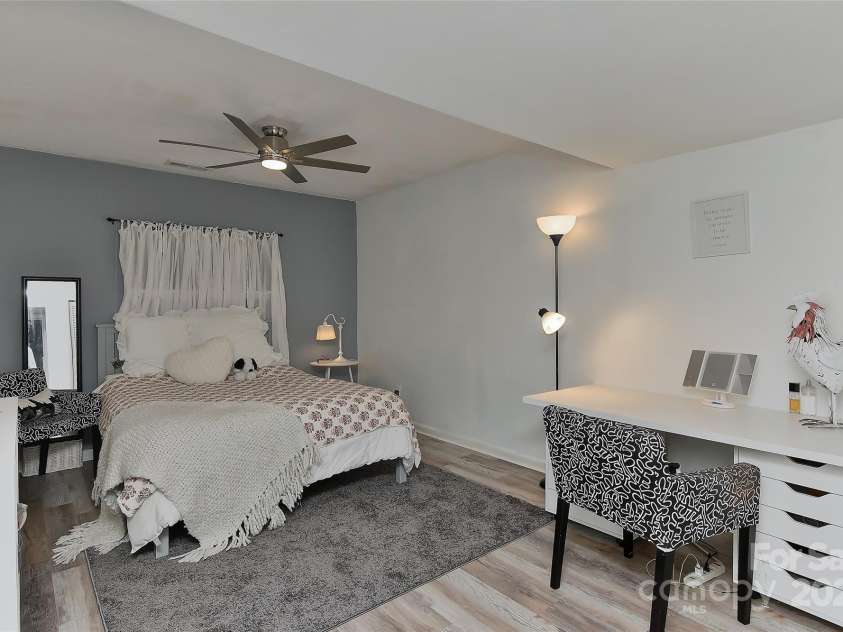 51 Old Post Road, Lake Wylie, SC 29710.  MLS# CAR4207674, YatesRealty ID 2950. 4th bedroom in lower level in basement with vinyl plank flooring, ceiling fan w/light & remote.
