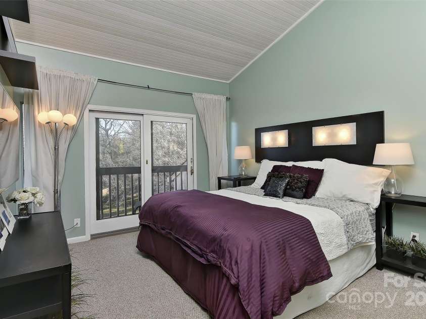 51 Old Post Road, Lake Wylie, SC 29710.  MLS# CAR4207674, YatesRealty ID 2950. Private & spacious primary suite upstairs with great covered deck w/amazing water views of Lake Wylie and vaulted wood ceilings.