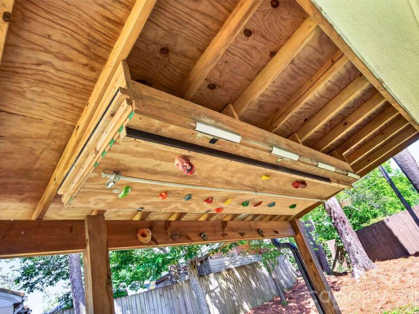 440 Carolina Avenue, Brevard, NC 28712.  MLS# CAR4390978, YatesRealty ID 29504. Built-In Climbing Wall Under Covered Patio