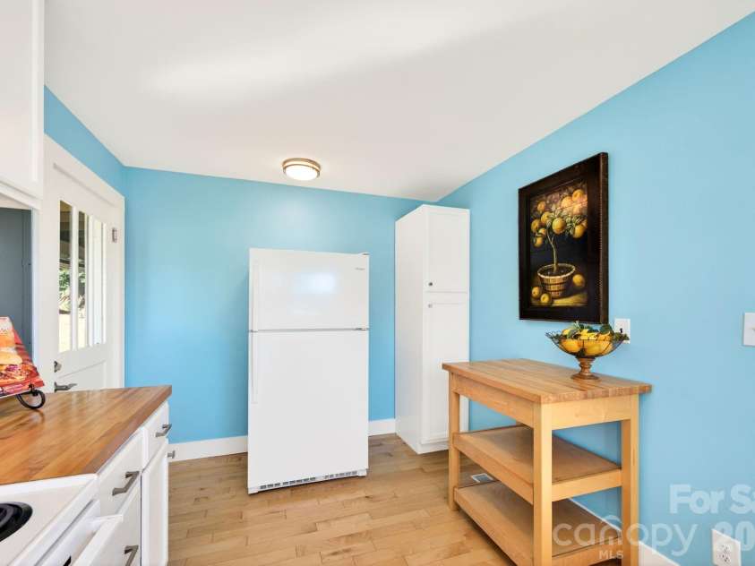 440 Carolina Avenue, Brevard, NC 28712.  MLS# CAR4390978, YatesRealty ID 29504. Custom solid wood Island with shelf