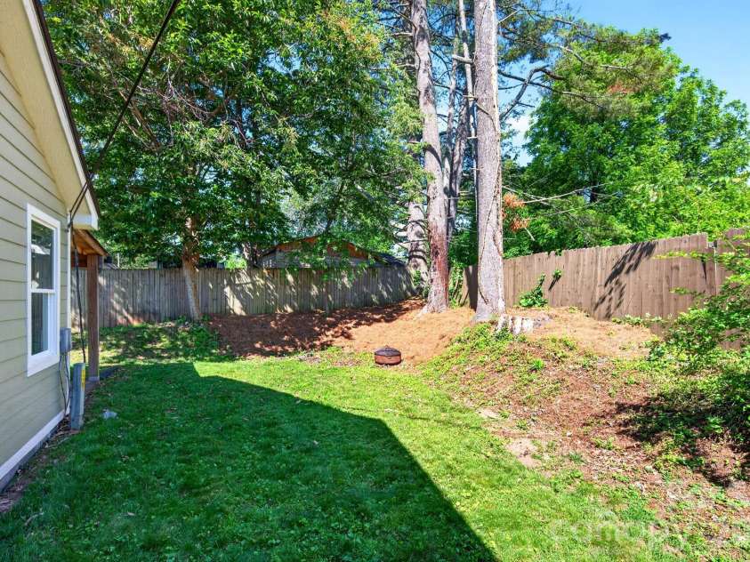 440 Carolina Avenue, Brevard, NC 28712.  MLS# CAR4390978, YatesRealty ID 29504. Side yard