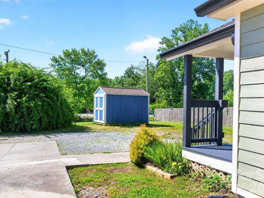 440 Carolina Avenue, Brevard, NC 28712.  MLS# CAR4390978, YatesRealty ID 29504. Side Yard with Storage Shed
