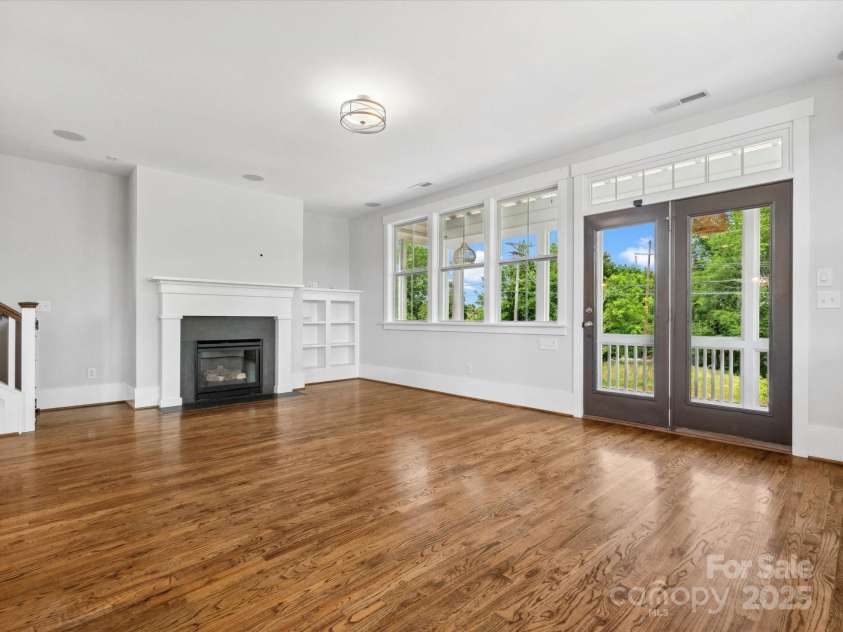 807 Herrons Ferry Road, Rock Hill, SC 29730.  MLS# CAR4263861, YatesRealty ID 29511. Living room leading to covered porch and open deck