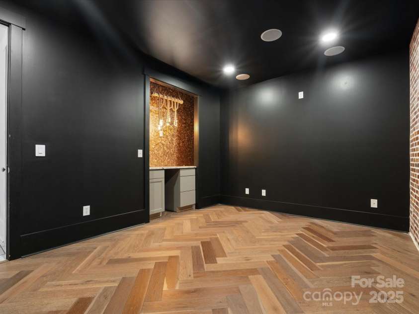 807 Herrons Ferry Road, Rock Hill, SC 29730.  MLS# CAR4263861, YatesRealty ID 29511. Lower level bedroom recently used as media room