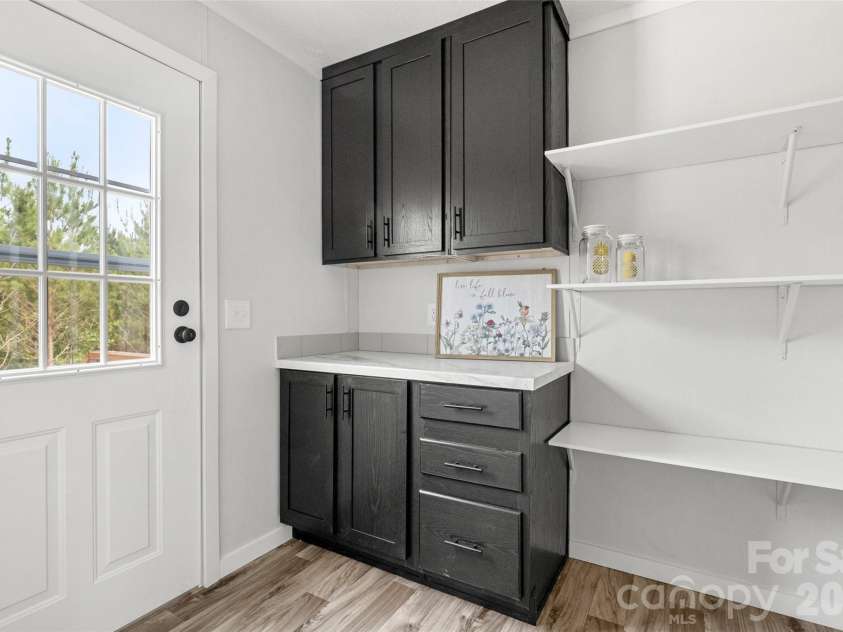 832 Jack Bone Hill Road, Jefferson, SC 29718.  MLS# CAR4391541, YatesRealty ID 29511. Spacious Pantry off Kitchen & Exterior Entrance