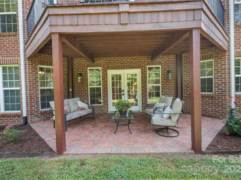 4660 Sugar Plum Lane, Davidson, NC 28036.  MLS# CAR4273062, YatesRealty ID 29516. Covered Patio accessible from Lower Level Living Rm.