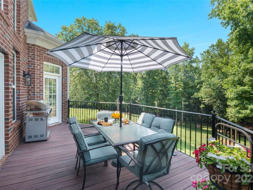 4660 Sugar Plum Lane, Davidson, NC 28036.  MLS# CAR4273062, YatesRealty ID 29516. Deck accessible from Breakfast Rm, Great Rm, and Primary Suite.