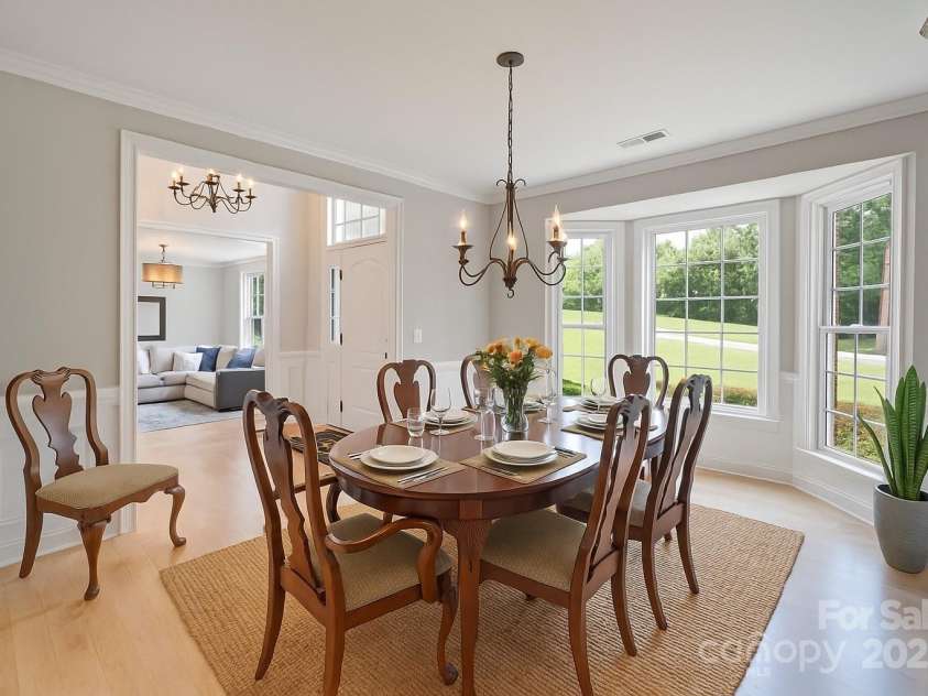4660 Sugar Plum Lane, Davidson, NC 28036.  MLS# CAR4273062, YatesRealty ID 29516. Dining Rm w/bay window and governors paneling