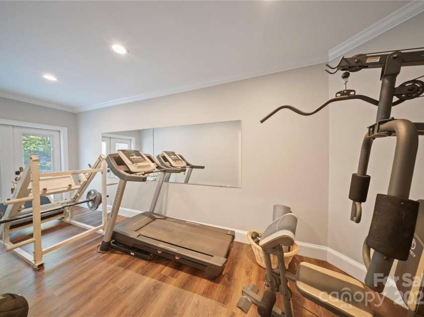 4660 Sugar Plum Lane, Davidson, NC 28036.  MLS# CAR4273062, YatesRealty ID 29516. Lower Level Exercise Rm with glass doors to back yard