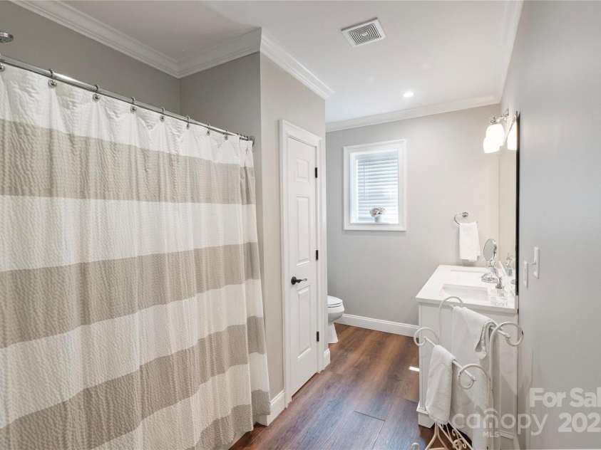 4660 Sugar Plum Lane, Davidson, NC 28036.  MLS# CAR4273062, YatesRealty ID 29516. Lower level guest bathroom