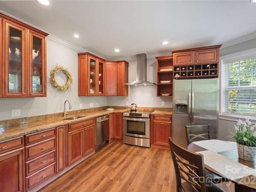 4660 Sugar Plum Lane, Davidson, NC 28036.  MLS# CAR4273062, YatesRealty ID 29516. Lower Level kitchen; custom cabinets w/granite countertops.