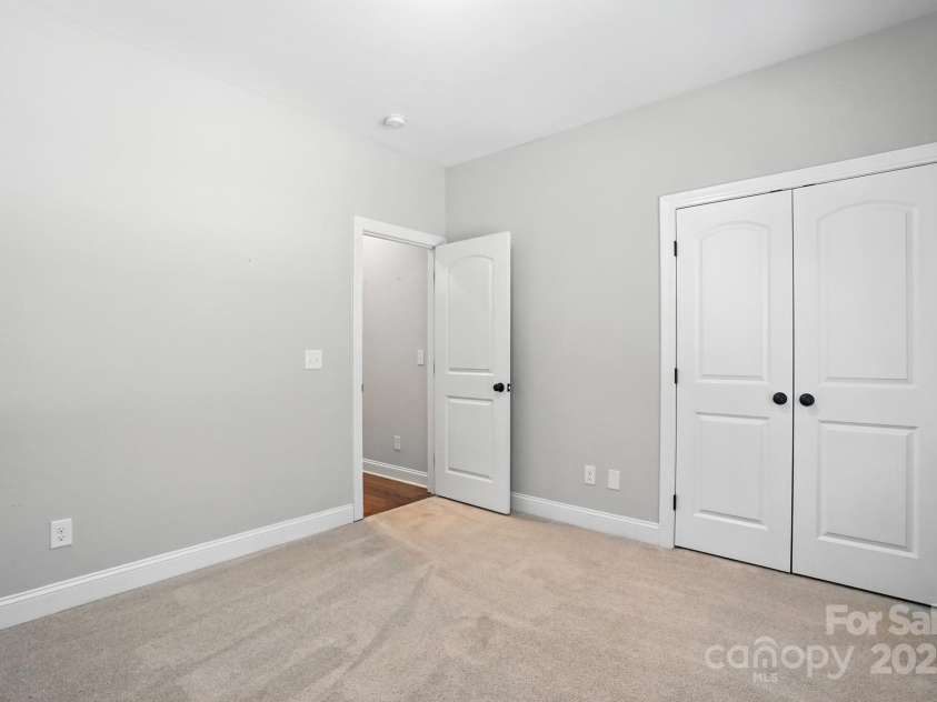 7006 Nesbit Road, Waxhaw, NC 28173.  MLS# CAR4297679, YatesRealty ID 29535. Secondary Bedroom - Main Level