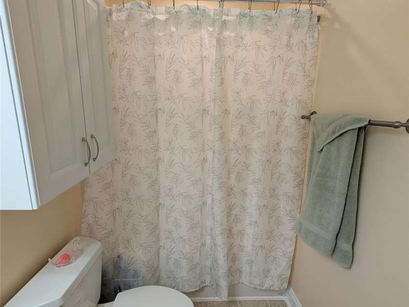 65 Foxden Drive, Fletcher, NC 28732.  MLS# CAR4389530, YatesRealty ID 29552. Front hall tub/shower