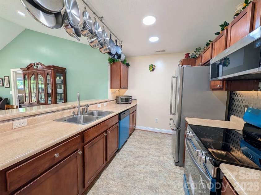 65 Foxden Drive, Fletcher, NC 28732.  MLS# CAR4389530, YatesRealty ID 29552. Length view bar side