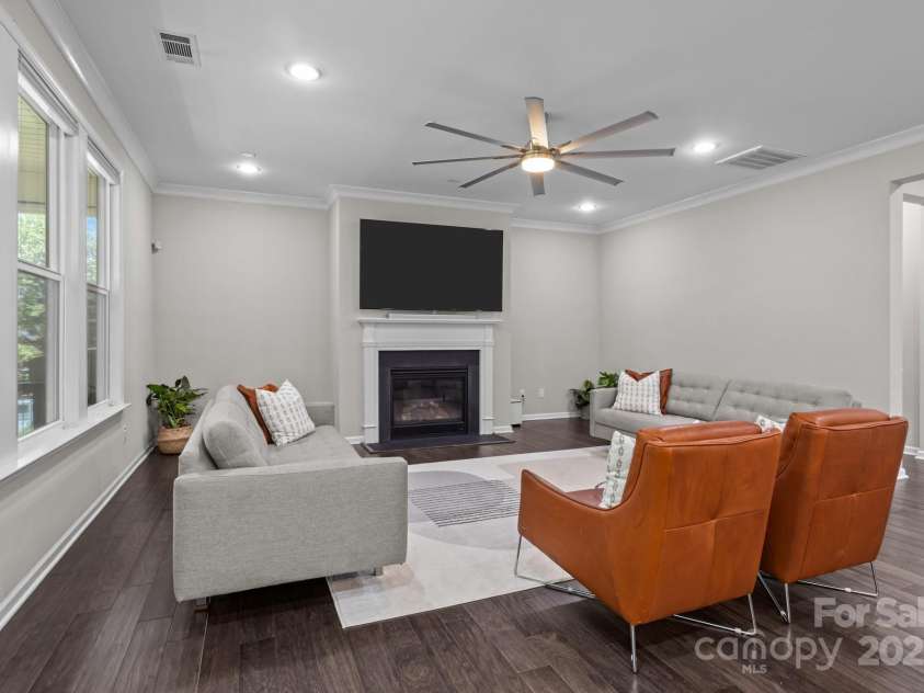 9426 Hightower Oak Street, Huntersville, NC 28078.  MLS# CAR4279151, YatesRealty ID 29552. Living room centers around the fireplace w/ nooks on each side just waiting to be personalized