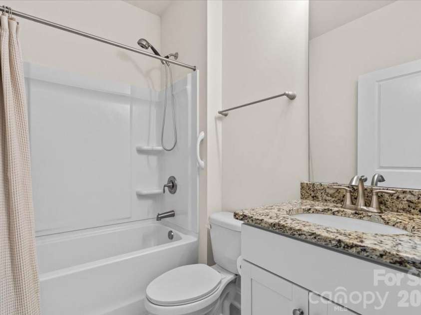 6040 Artigas Drive, Fort Mill, SC 29707.  MLS# CAR4390680, YatesRealty ID 29555. Downstairs full bath