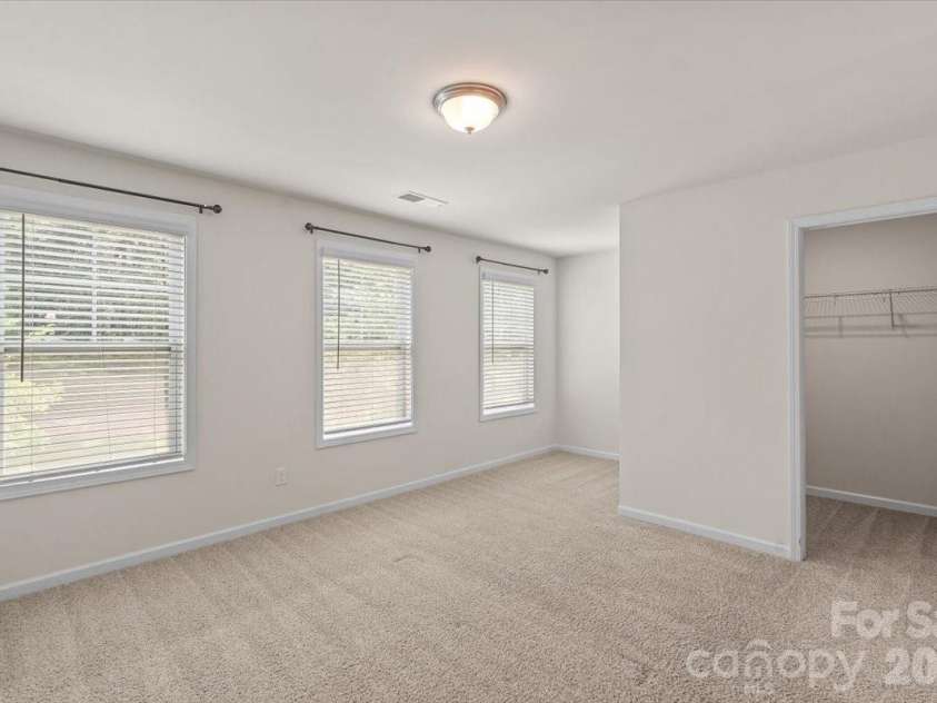 6040 Artigas Drive, Fort Mill, SC 29707.  MLS# CAR4390680, YatesRealty ID 29555. Front left bedroom upstairs with a huge closet