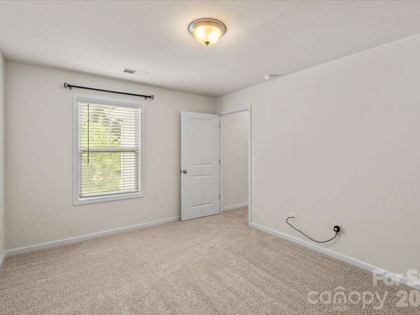 6040 Artigas Drive, Fort Mill, SC 29707.  MLS# CAR4390680, YatesRealty ID 29555. Front right bdrm