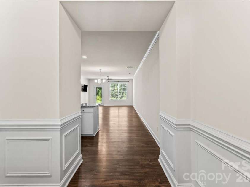 6040 Artigas Drive, Fort Mill, SC 29707.  MLS# CAR4390680, YatesRealty ID 29555. Large inviting foyer with heavy millwork.