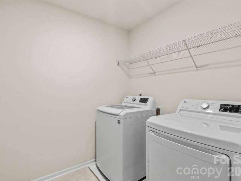 6040 Artigas Drive, Fort Mill, SC 29707.  MLS# CAR4390680, YatesRealty ID 29555. Large laundry room is upstairs