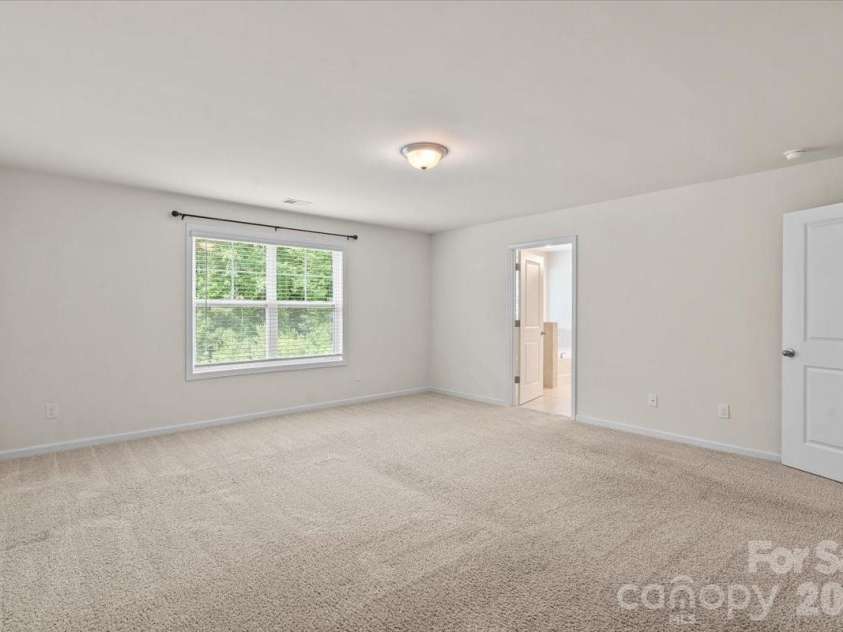 6040 Artigas Drive, Fort Mill, SC 29707.  MLS# CAR4390680, YatesRealty ID 29555. Primary bedroom