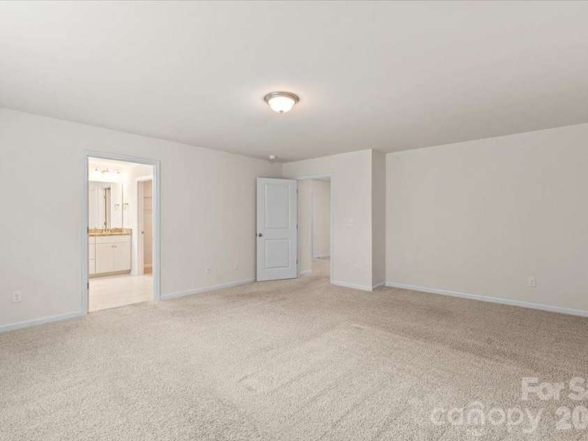 6040 Artigas Drive, Fort Mill, SC 29707.  MLS# CAR4390680, YatesRealty ID 29555. Primary bedroom