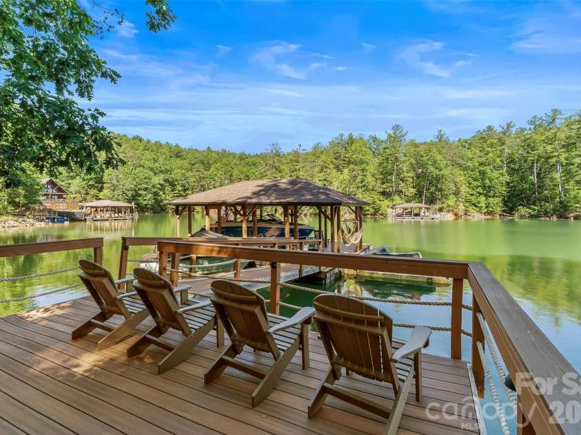 2087 Firestone Trail, Nebo, NC 28761.  MLS# CAR4390995, YatesRealty ID 29557. Private covered dock on peaceful cove