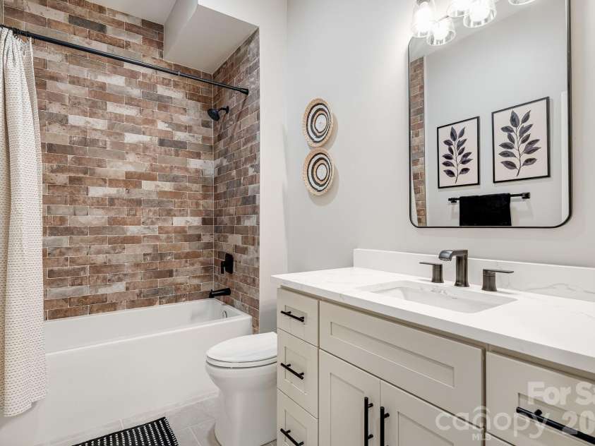 163 Northview Drive, Hendersonville, NC 28791.  MLS# CAR4390968, YatesRealty ID 29570. Lower bathroom