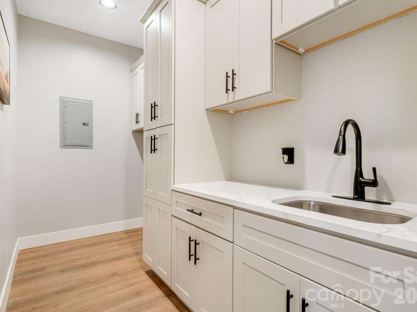 163 Northview Drive, Hendersonville, NC 28791.  MLS# CAR4390968, YatesRealty ID 29570. Lower laundry